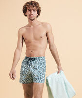 Beach Towel in Organic Cotton Turtles Jacquard Thalassa men front worn view