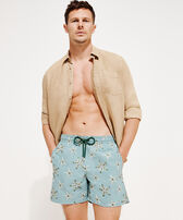 Men Swim Trunks Embroidered Starfish Dance - Limited Edition Mineral blue front worn view