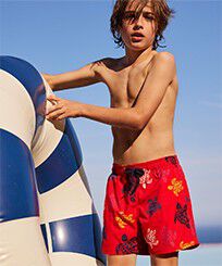 Boys Stretch Swim Shorts Ronde des Tortues Multicolores Poppy red front worn view