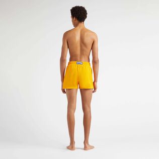 Men Swimwear Short and Fitted Stretch Solid Mango back worn view