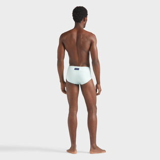Men Swim brief Solid Blue note back worn view