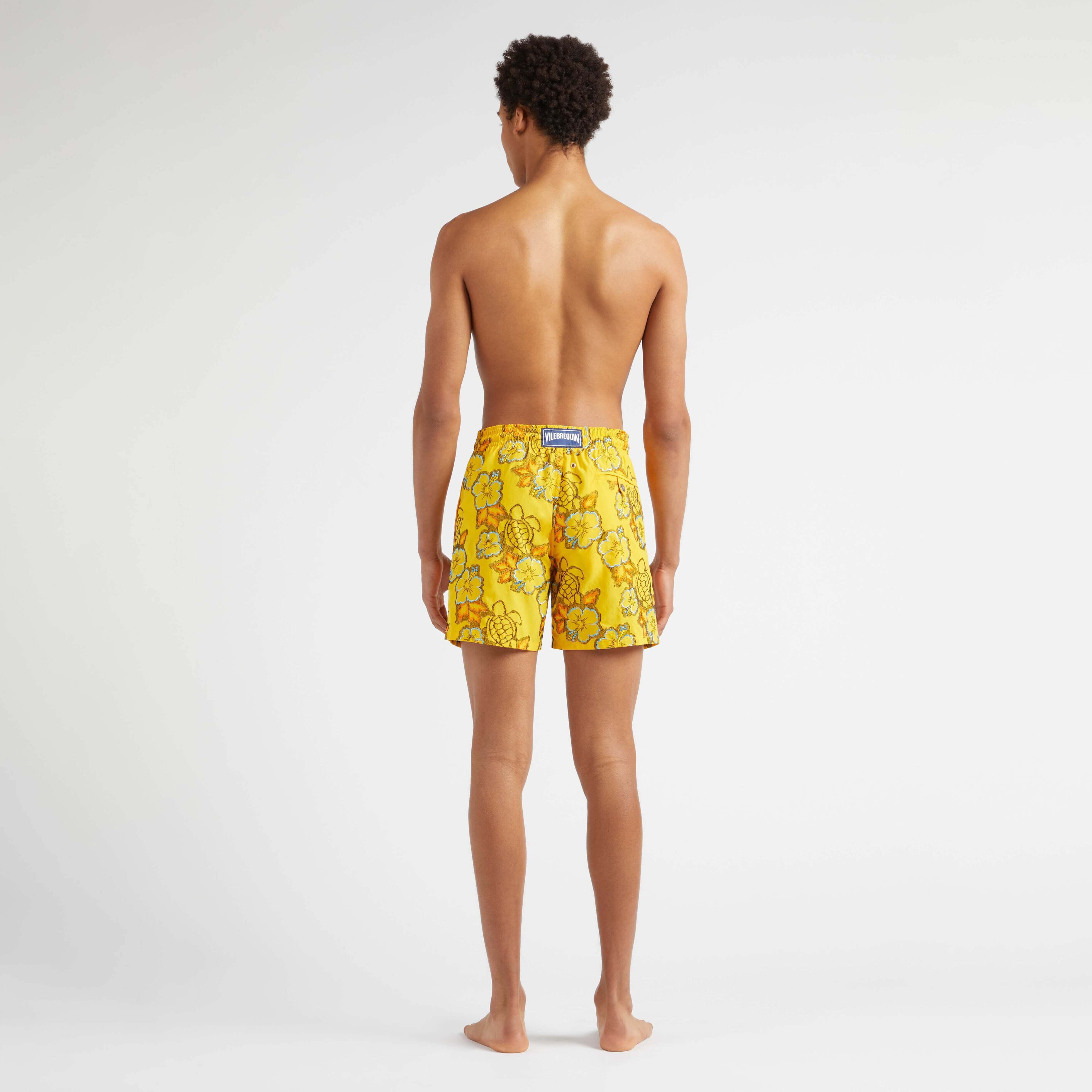 Gold hibiscus print swim shorts deals