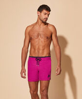 Men Swim Trunks Solid Crimson purple front worn view
