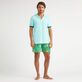 Polo en piqué coton organique homme uni Lagon vue portée de face