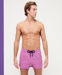 Men Swim Trunks Short and Fitted Stretch Solid Pink dahlia front worn view
