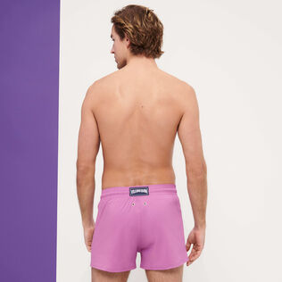 Men Swimwear Short and Fitted Stretch Solid Pink dahlia back worn view