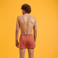 Men Swimwear Short and Fitted Stretch Solid Tomette back worn view