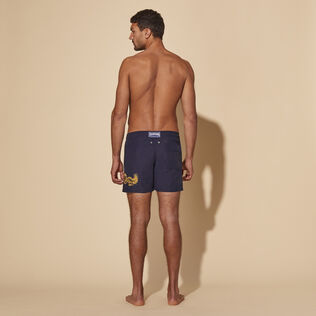 Men Placed Embroidery Swim Shorts The Year of the Dragon Navy back worn view