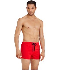 Men Swimwear Short and Fitted Stretch Solid Medicis red front worn view
