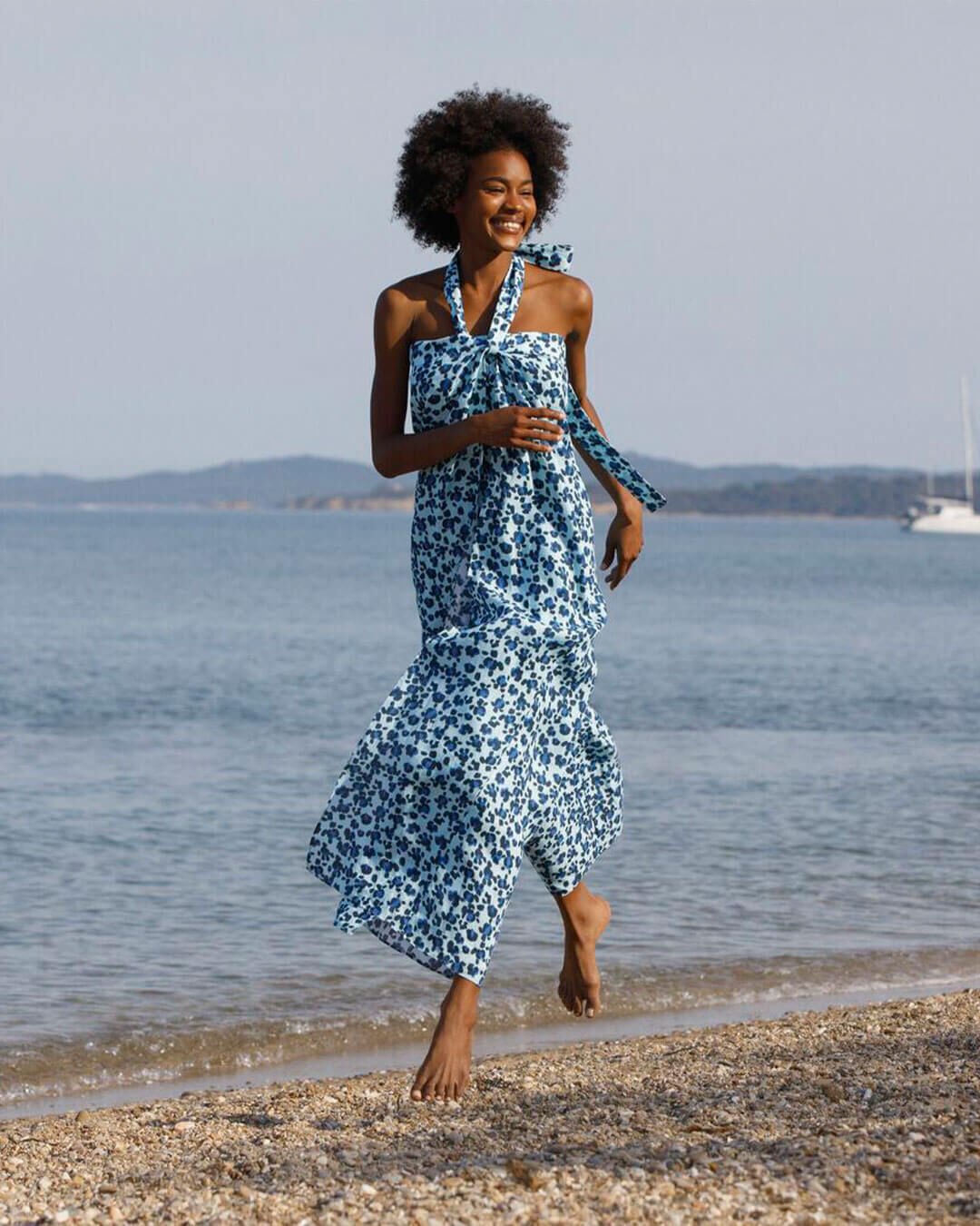 A woman jumping on a beach