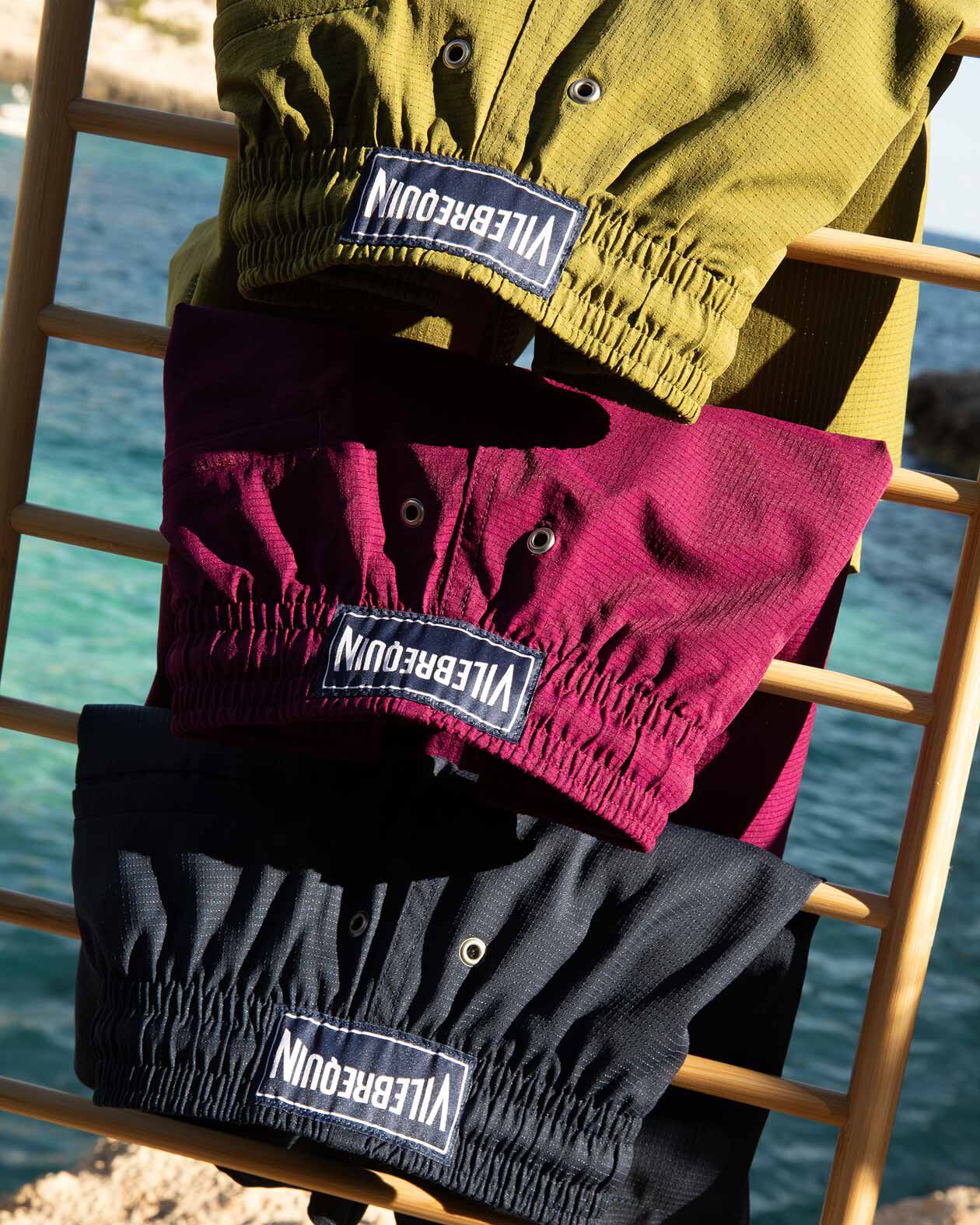 Micro-Perforated Fabric Three micro-perforated swimwear on the beach