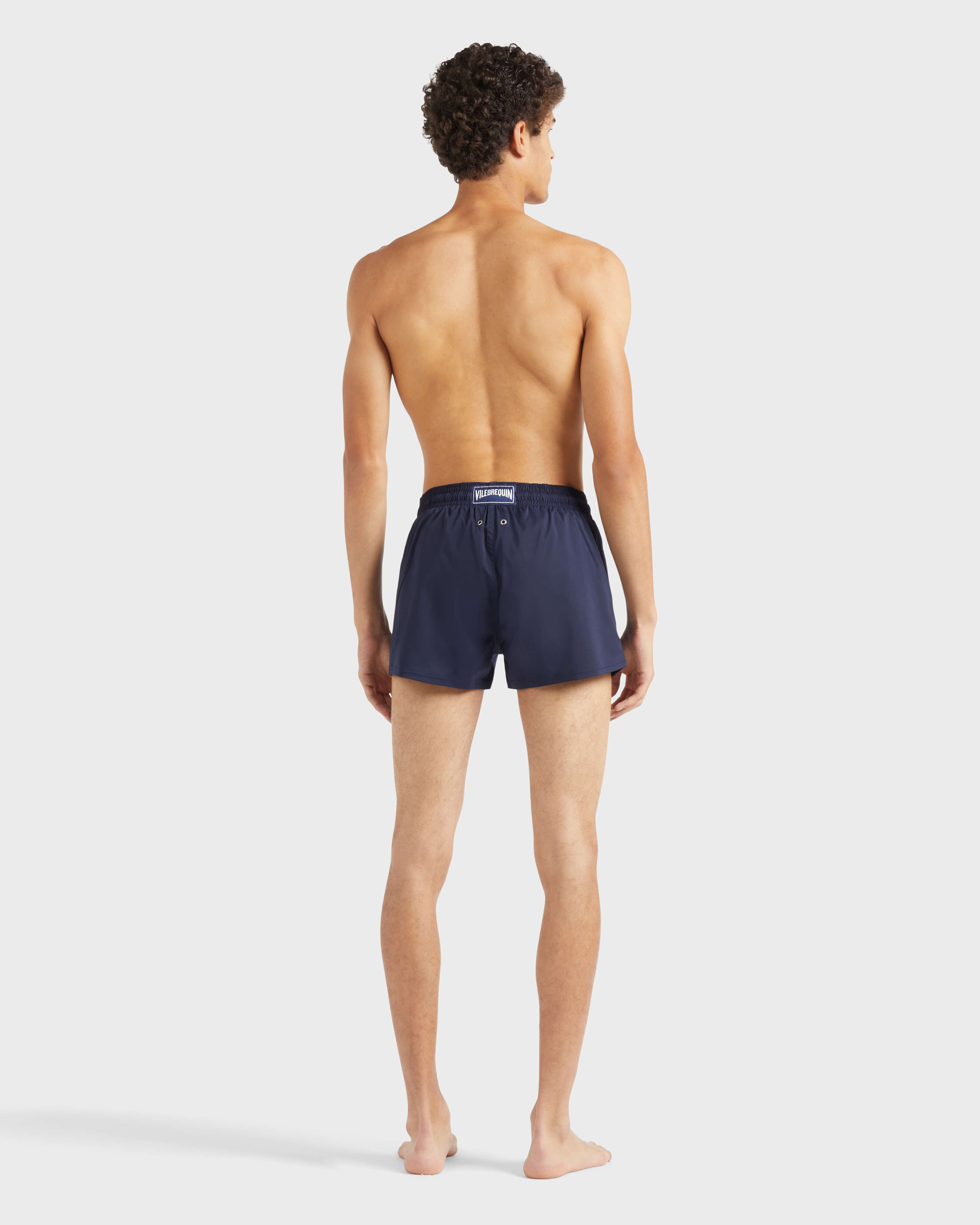 Men Swimwear Short and Fitted Stretch Solid NAVY backworn view