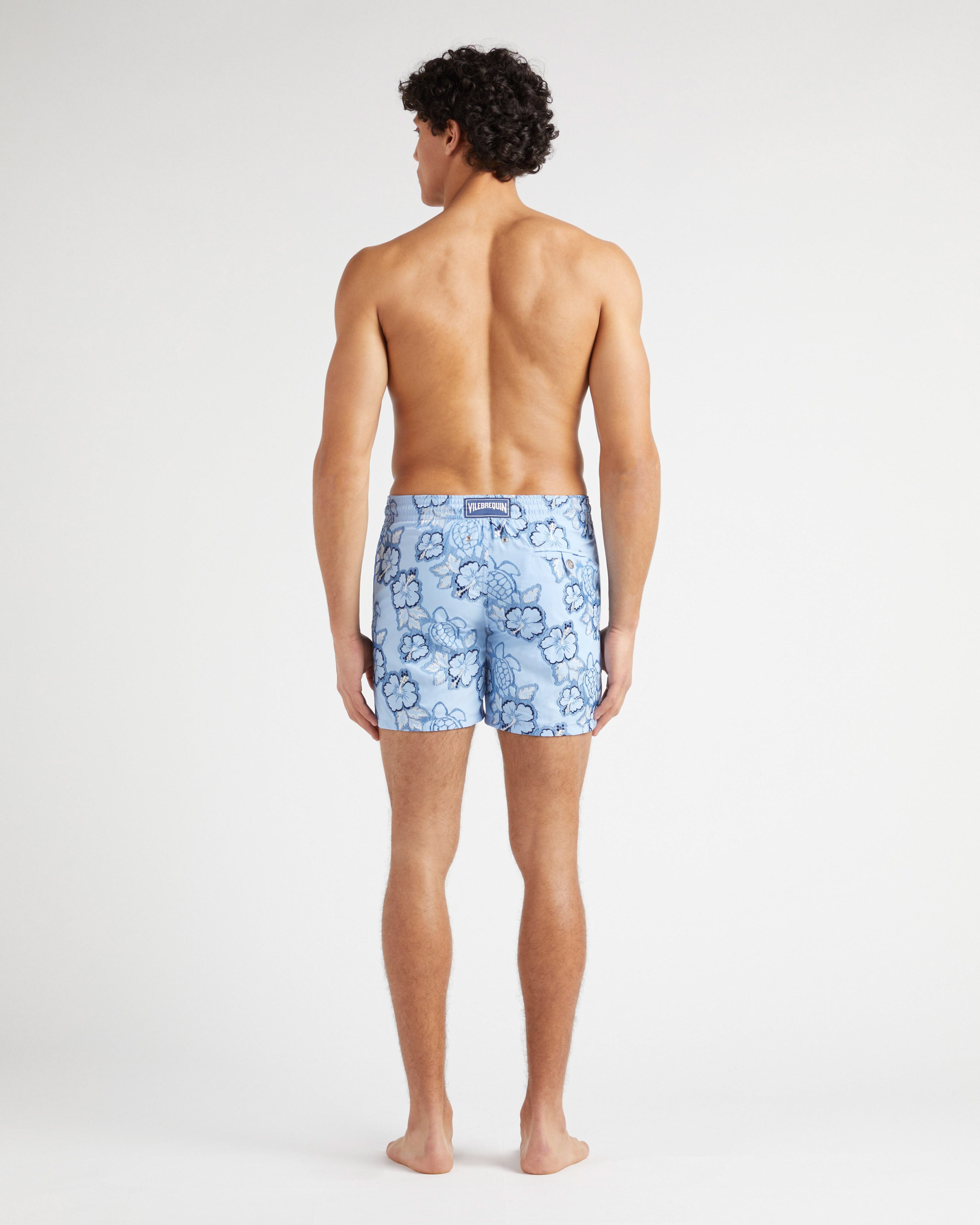 Men Swim Trunks Embroidered Hibiscus - Limited Edition FLAX FLOWER backworn view