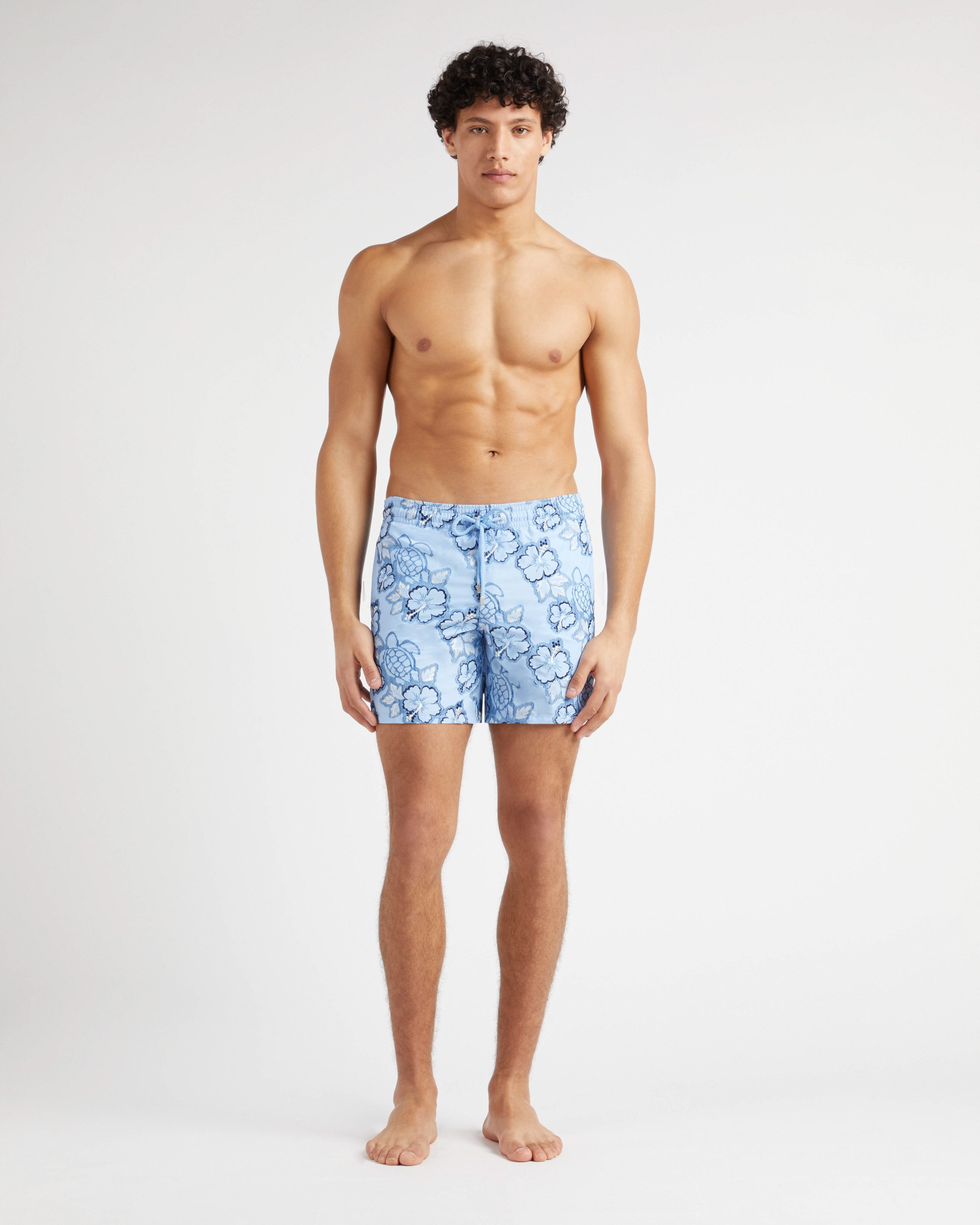 Men Swim Trunks Embroidered Hibiscus - Limited Edition FLAX FLOWER frontworn view