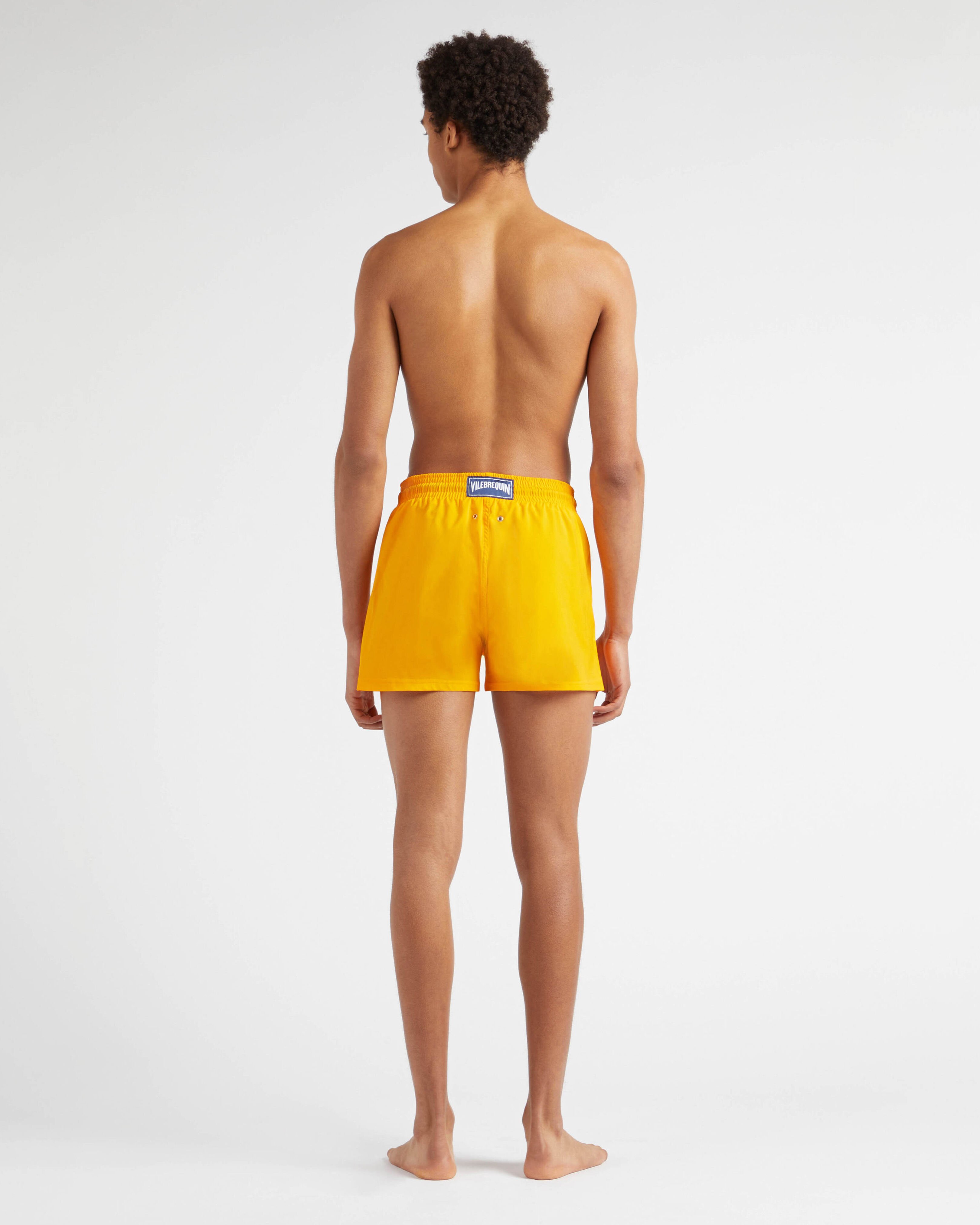 Men Swimwear Short and Fitted Stretch Solid MANGO backworn view