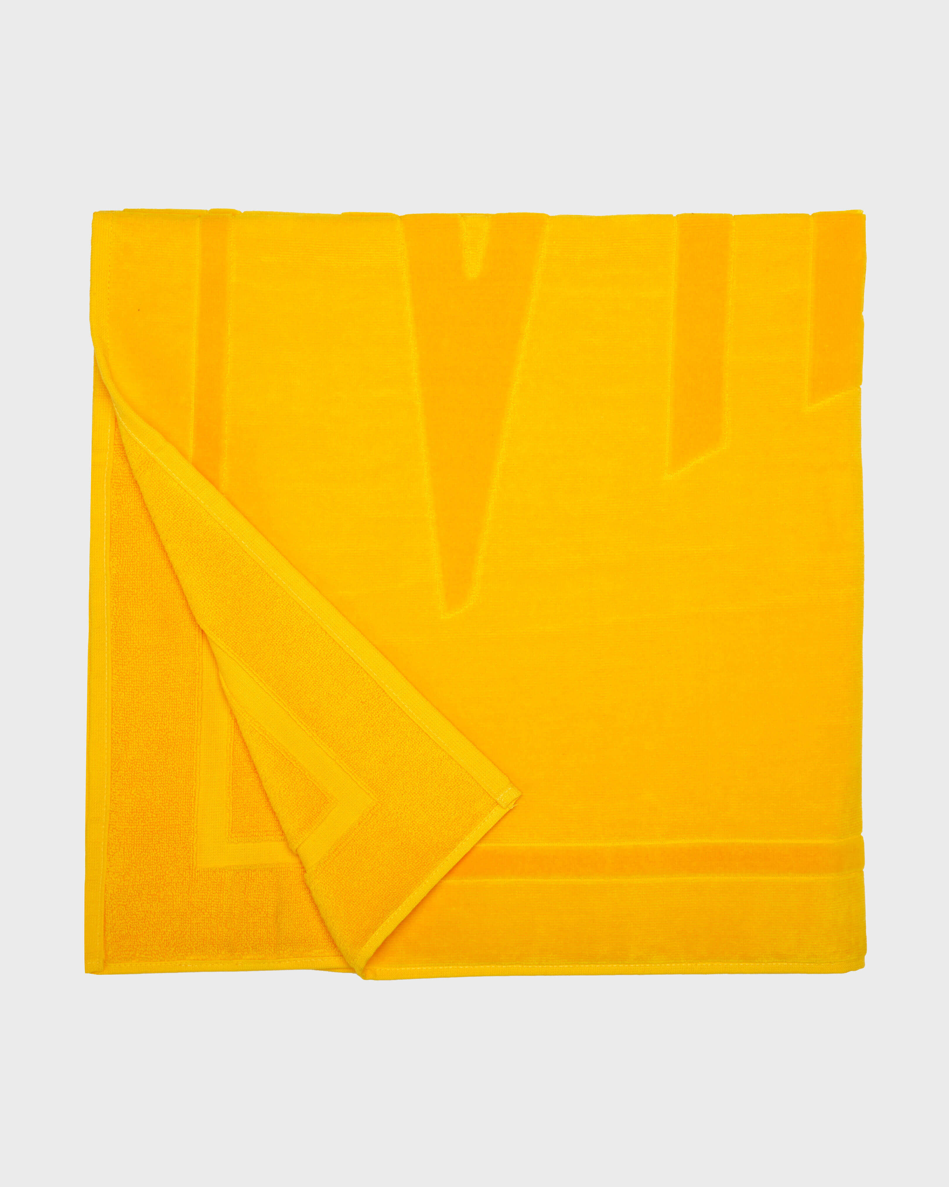 Toalla de playa de color liso y en algodón orgánico MAIZ back view