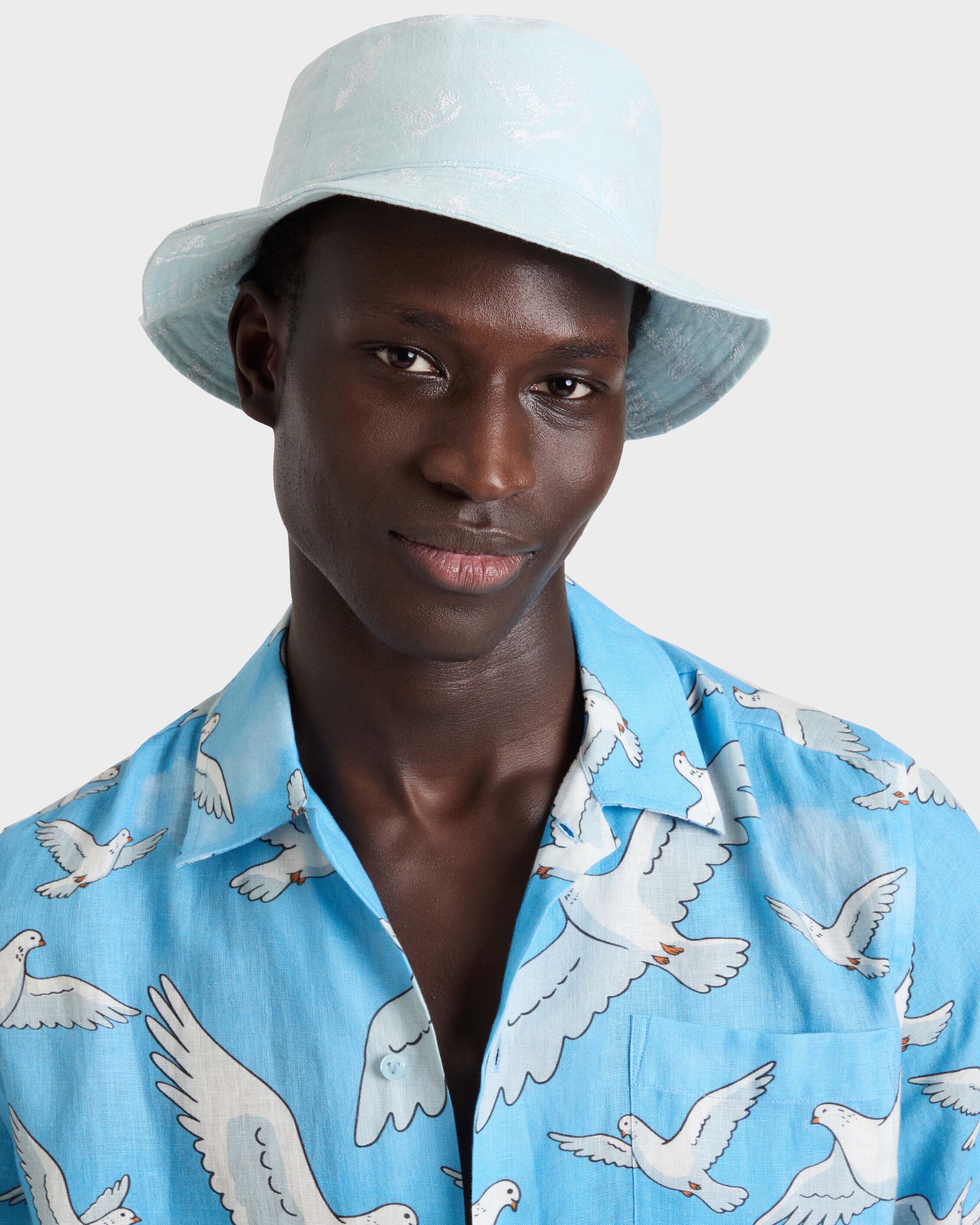 Linen Bucket Hat Doves - Vilebrequin x 3.PARADIS FROSTED BLUE frontworn view