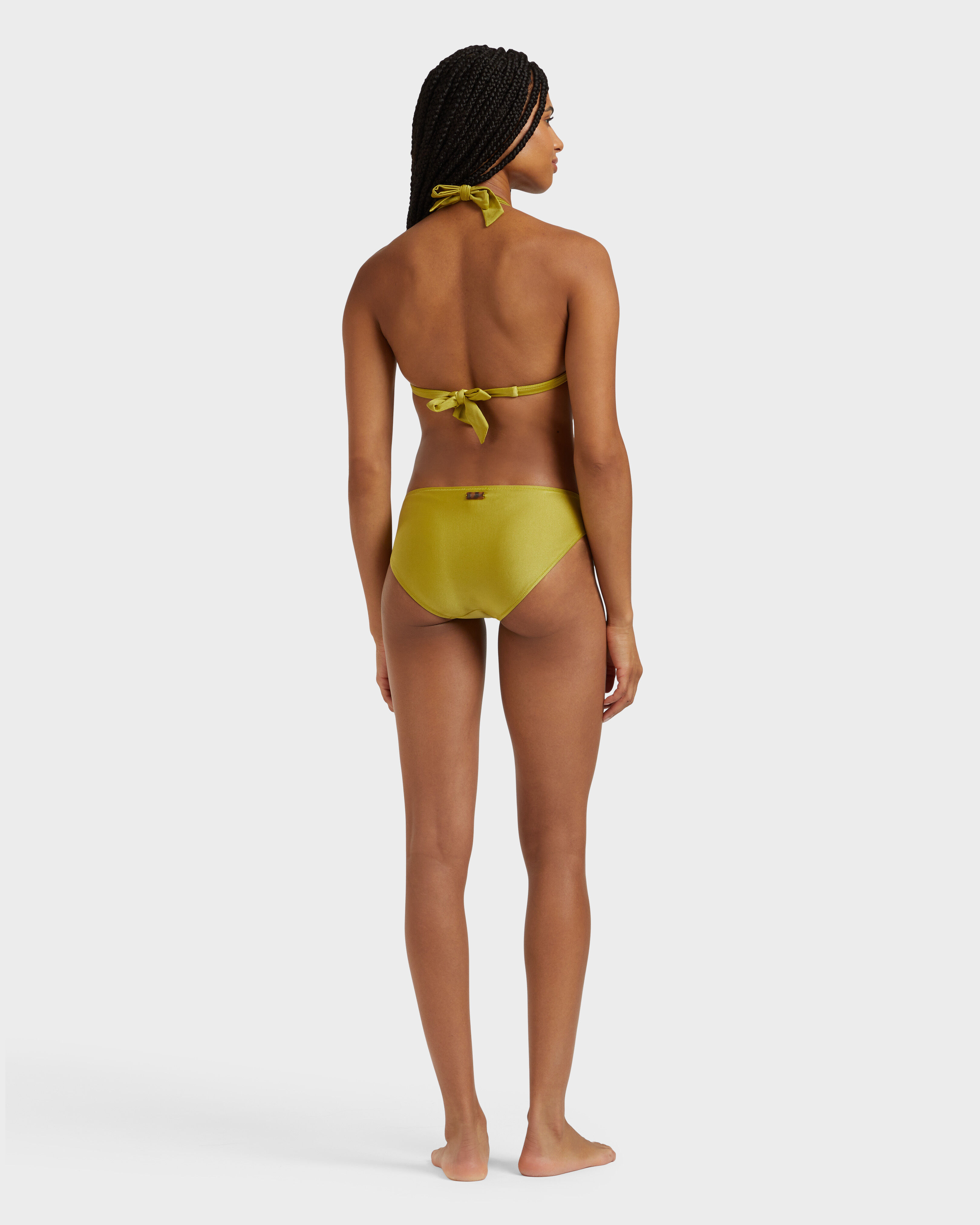 Slip bikini donna tinta unita elasticizzato lucido a vita media VERDE PALLIDO backworn view