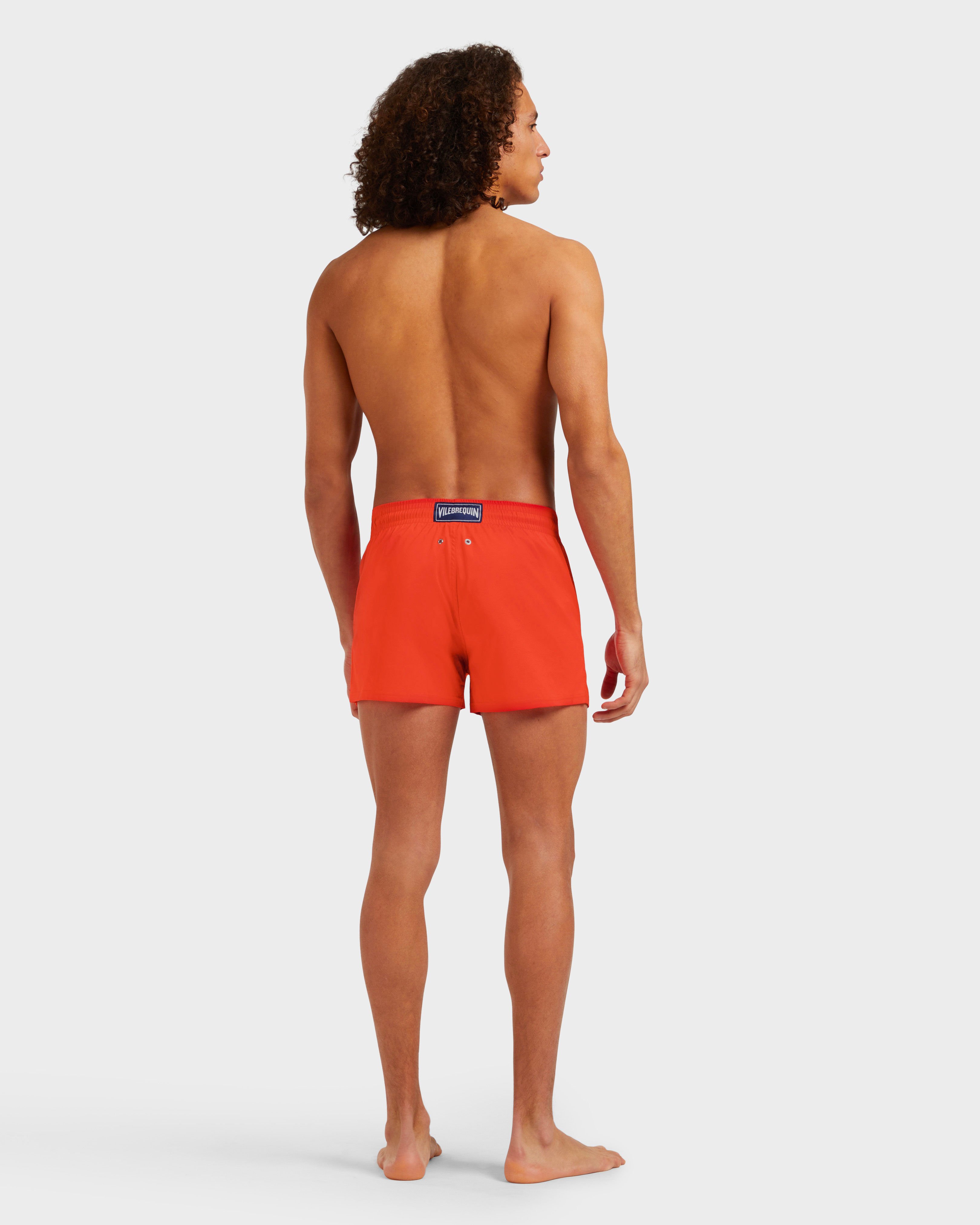 Men Swimwear Short and Fitted Stretch Solid GUAVA backworn view