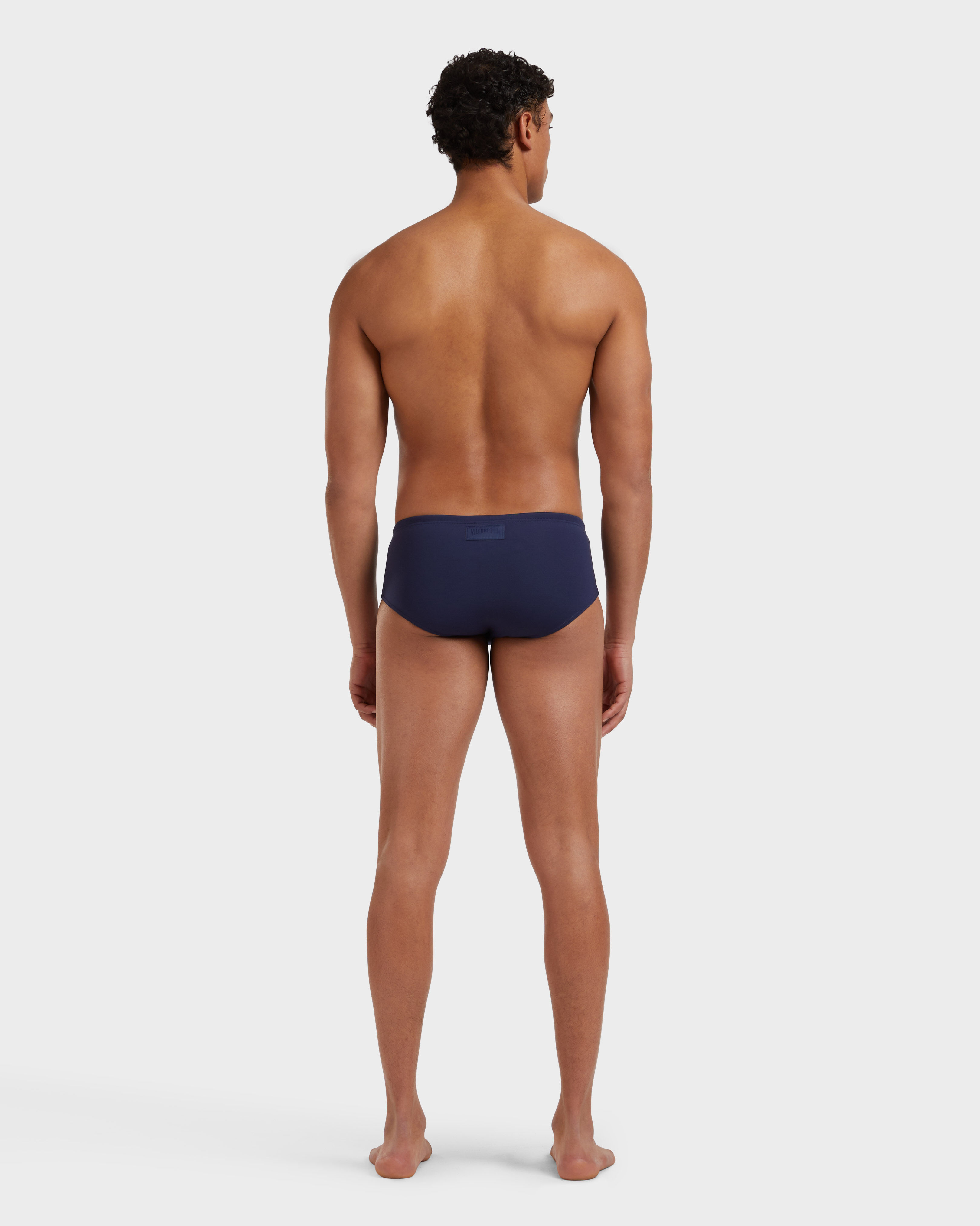 Men Swim brief Solid NAVY backworn view