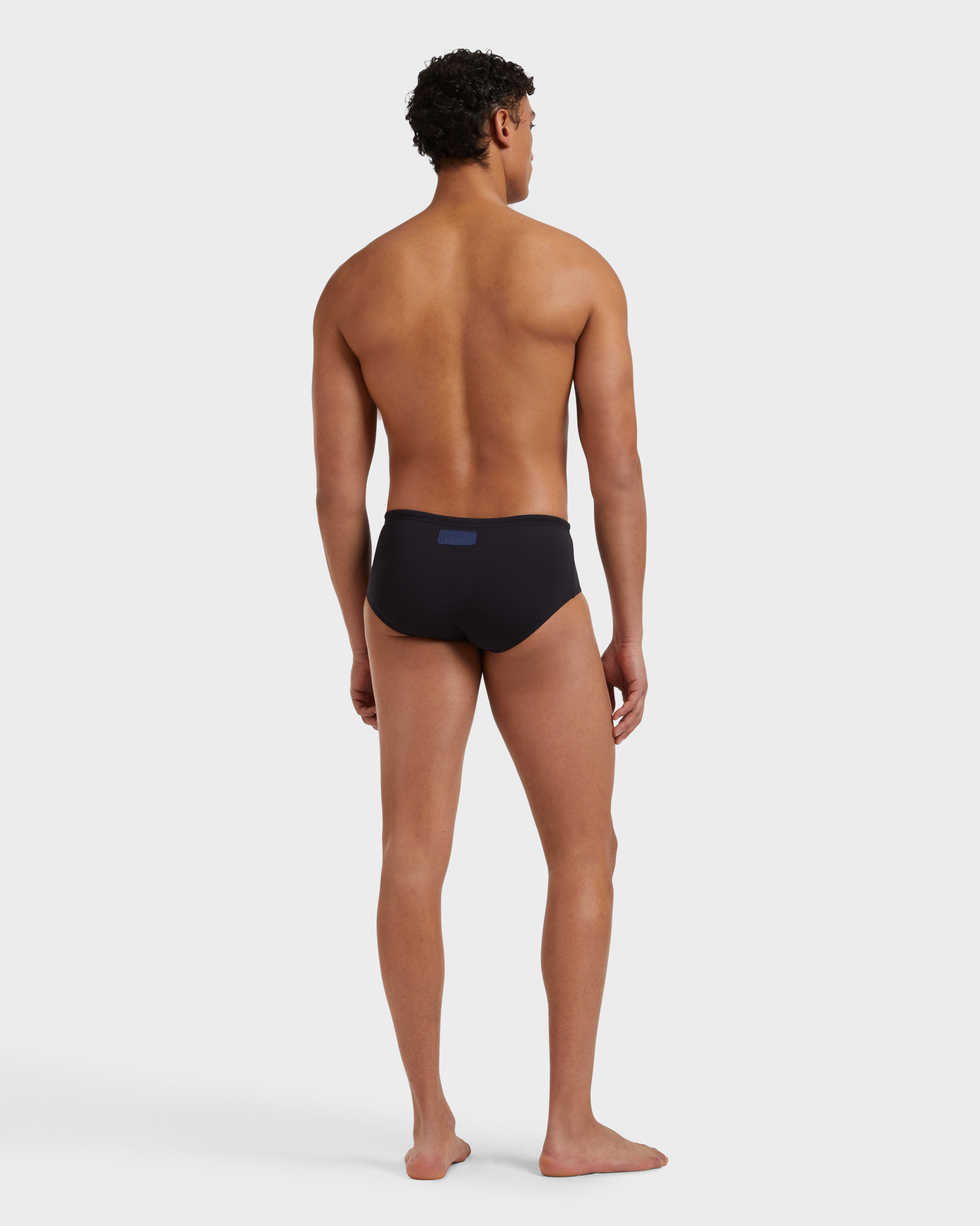 Men Swim brief Solid BLACK backworn view