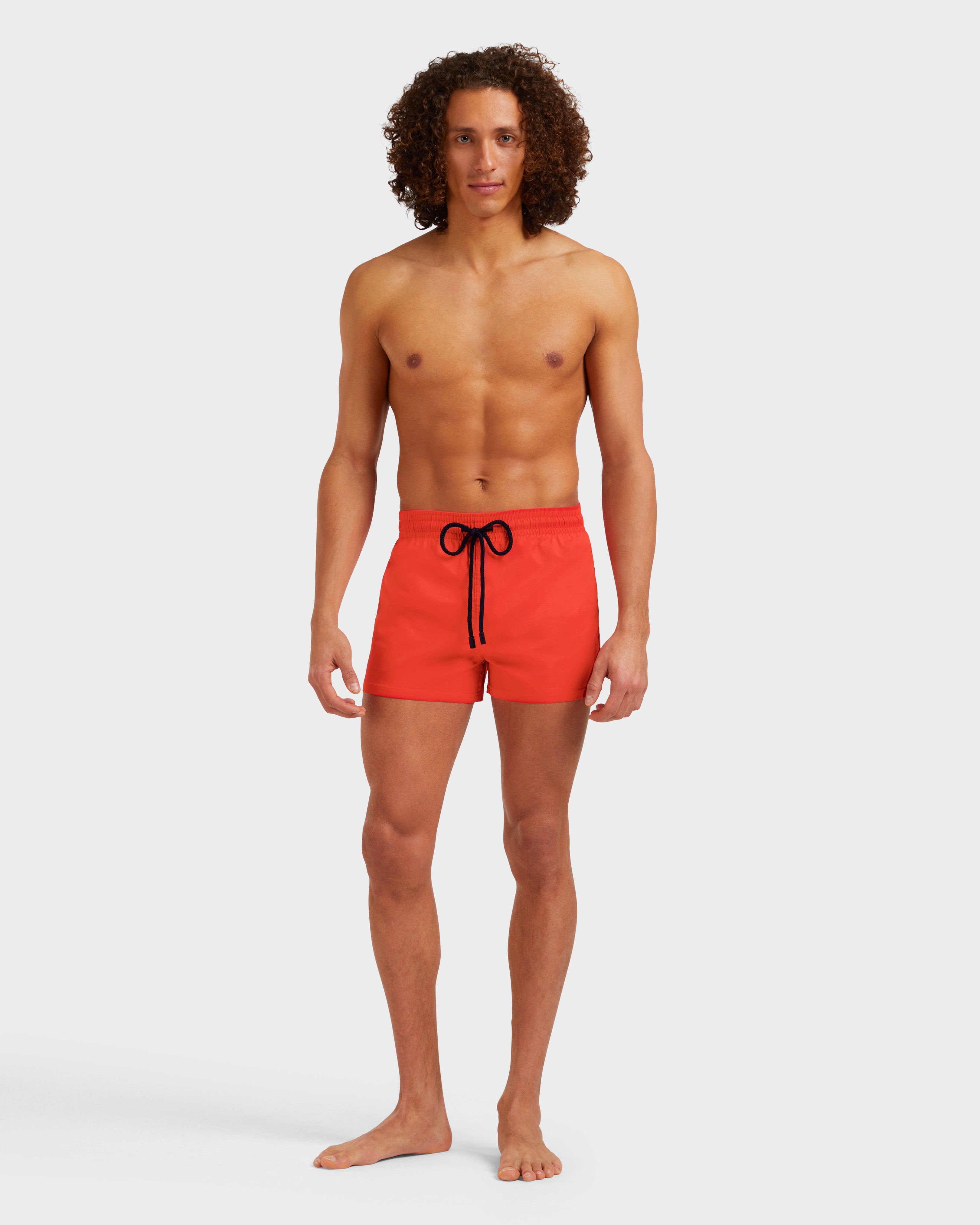 Men Swimwear Short and Fitted Stretch Solid GUAVA frontworn view