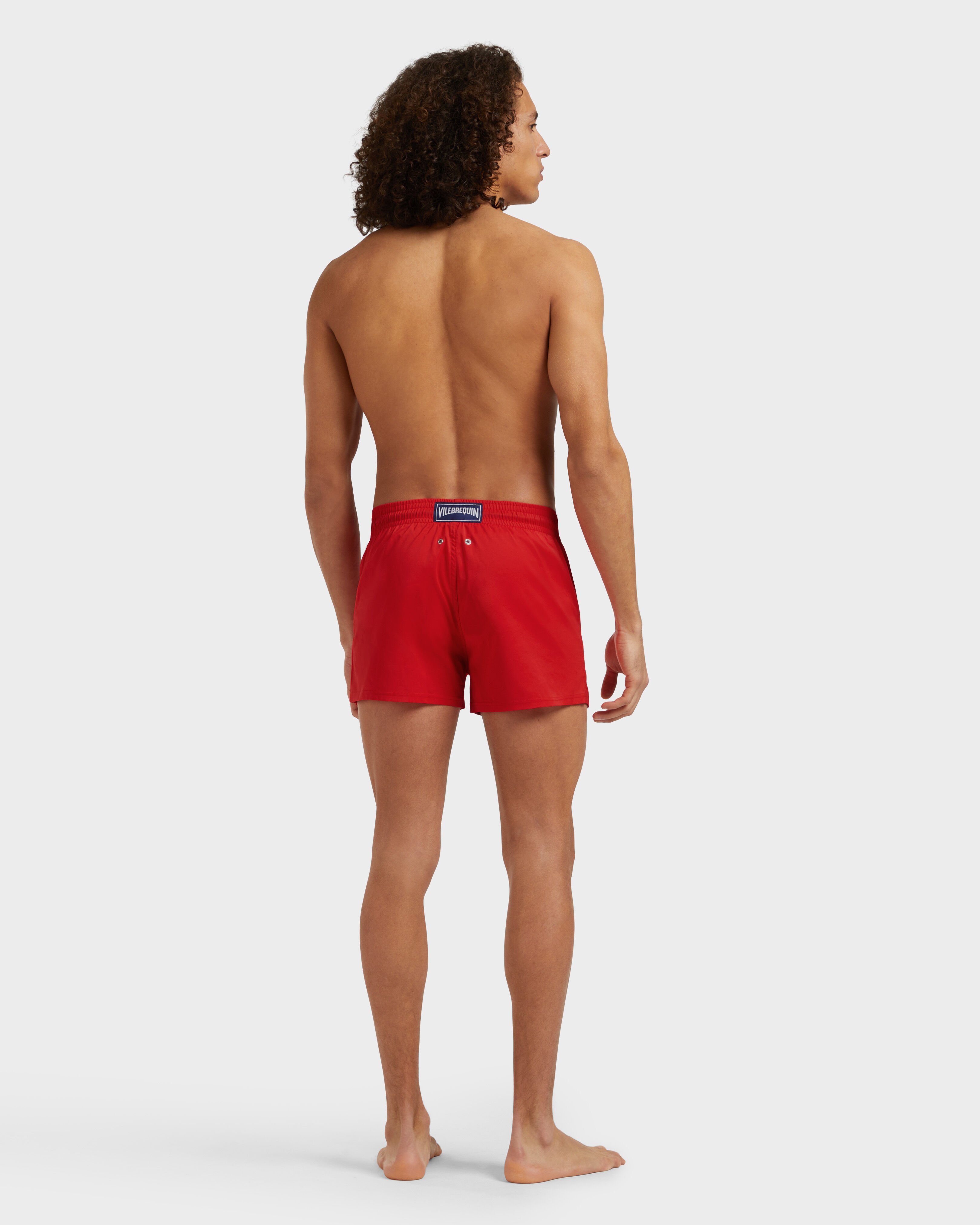 Men Swimwear Short and Fitted Stretch Solid MEDICIS RED backworn view