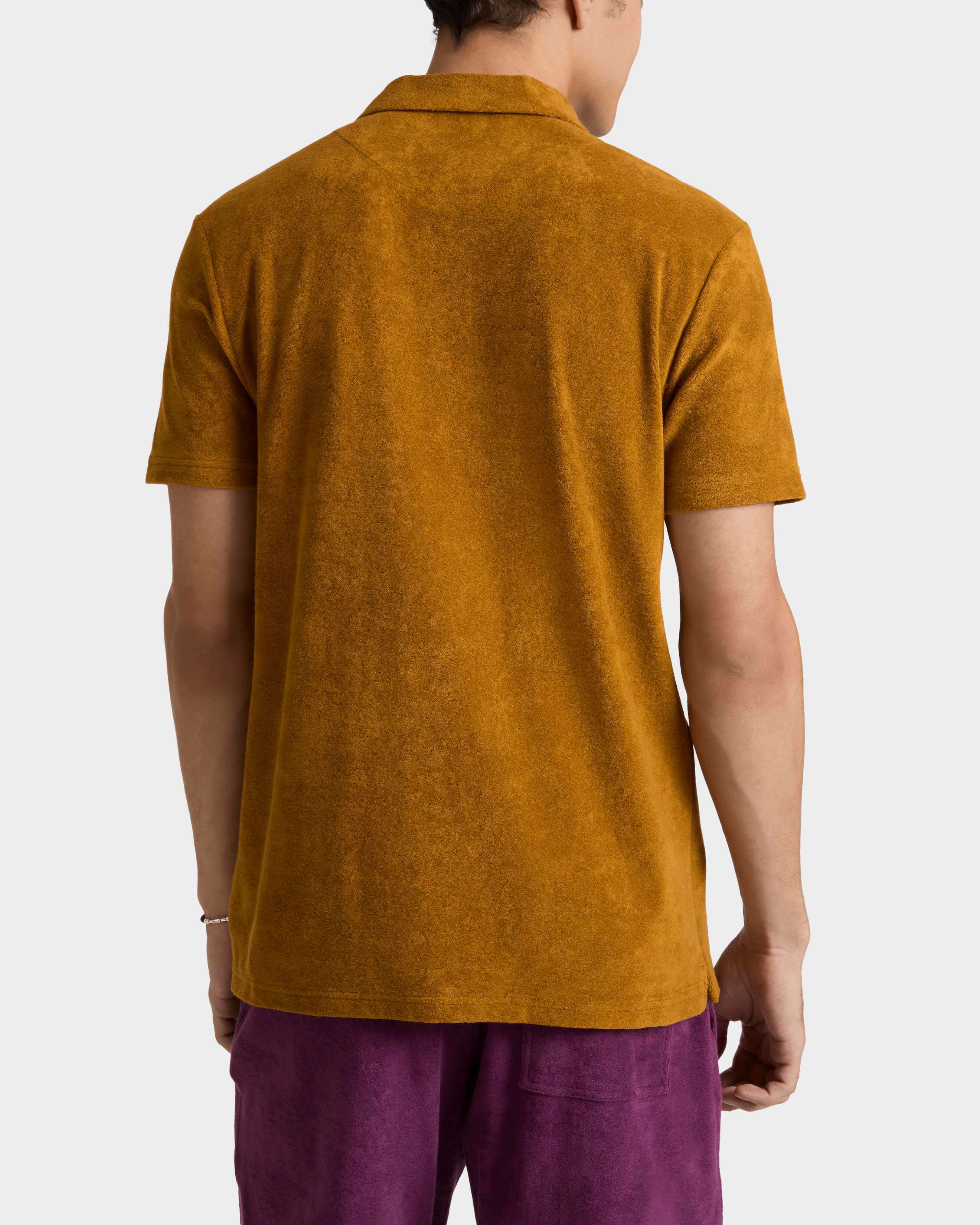 Polo en coton éponge organique homme uni MUD backworn view