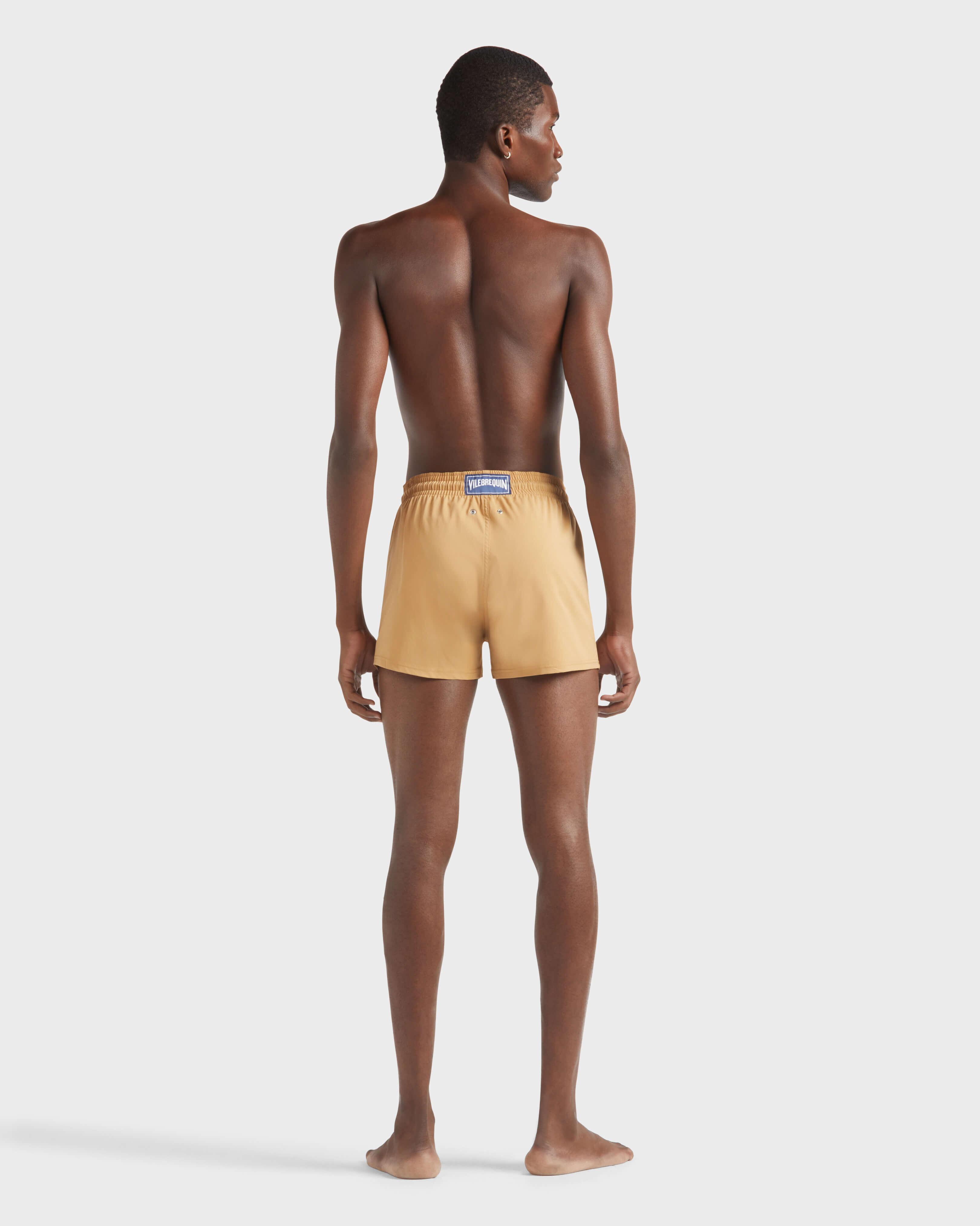 Men Swimwear Short and Fitted Stretch Solid MOCHA backworn view