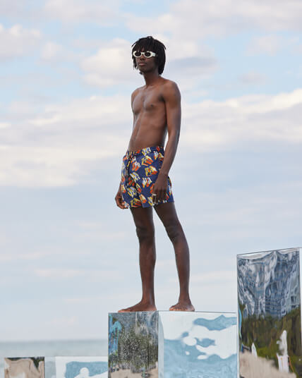 Man wearing Vilebrequin swimsuit