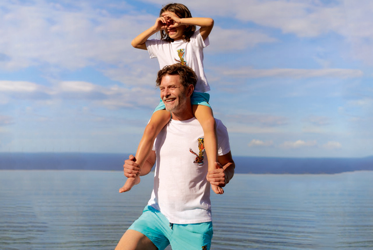 Father and son wearing matching shorts