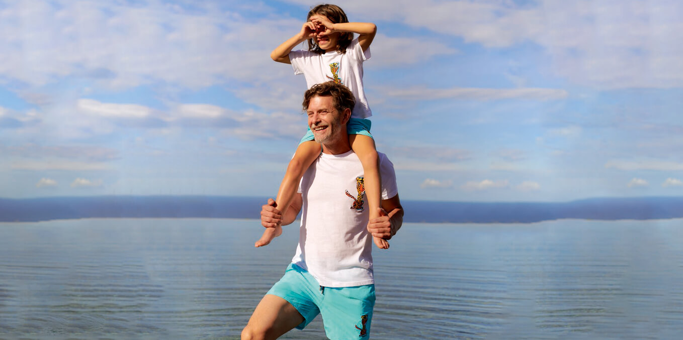 Father and son wearing matching shorts