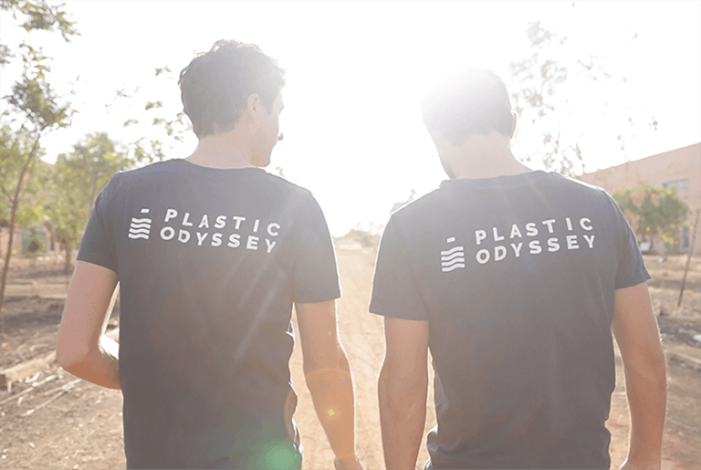 Two man from the back with Plastic Odyssey Polos