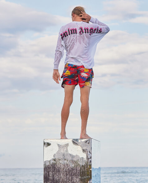 Man wearing a Hawaiian swim shorts