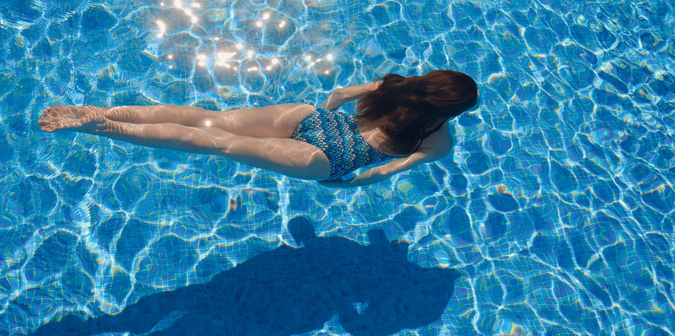 Woman wearing a Turtle Art one-piece swimsuit