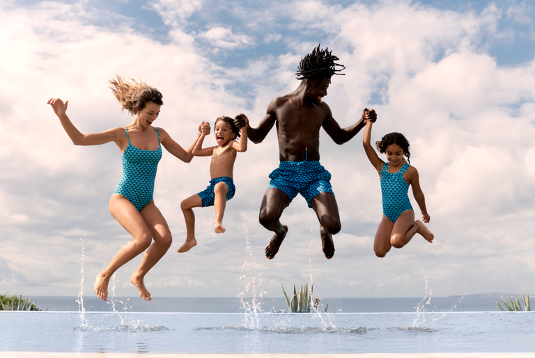 Family wearing matching swimsuits