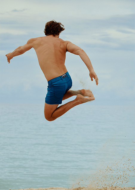 Man wearing a blue swim short