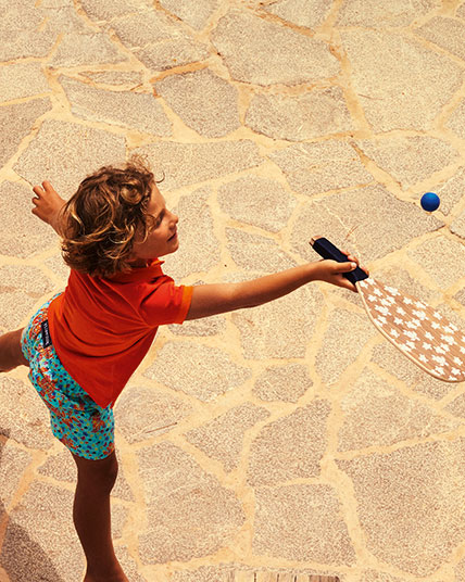 Boy playing with beach games