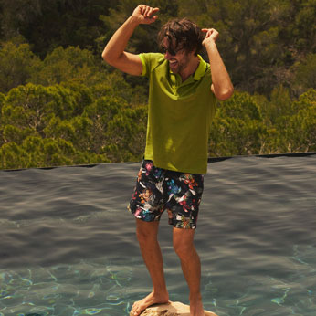 Men in a Vilebrequin swimsuit dancing at the pool