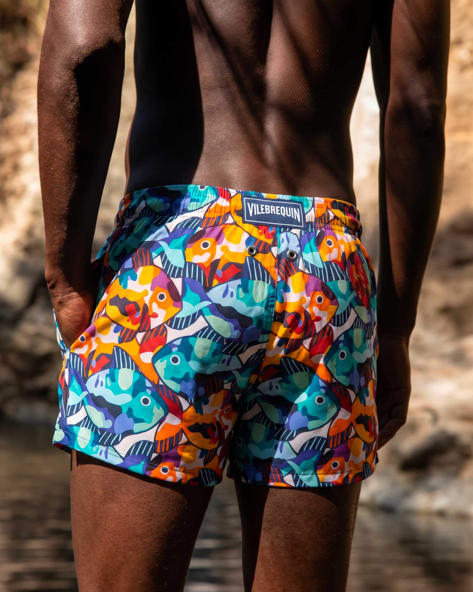 Back view of a man wearing printed swimshort
