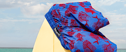 Flocked Swimsuit on surfboard