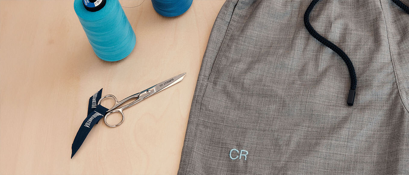 Embroidering a monogram on a men swim trunk