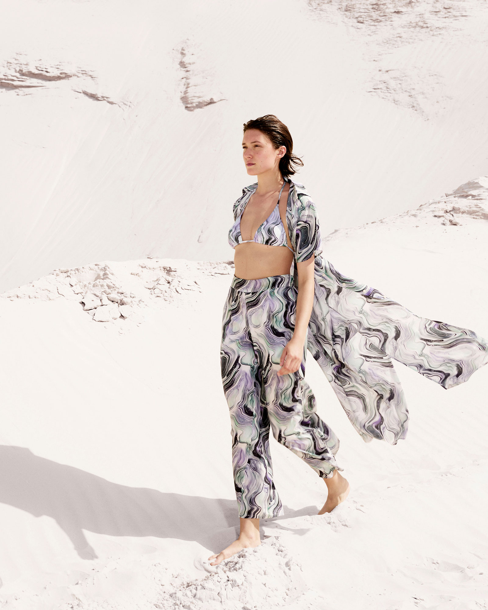 Woman wearing pants with oyster print design