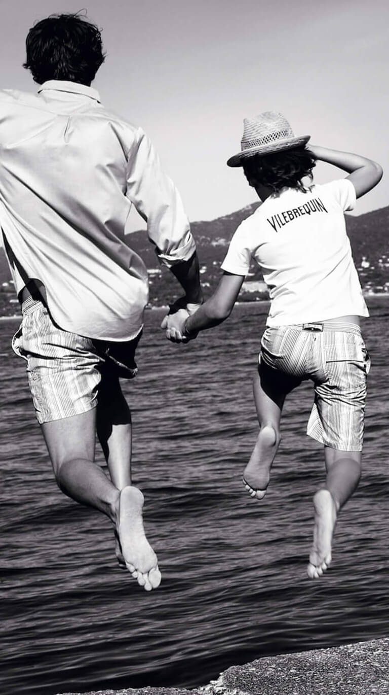 Father and son wearing beach clothing