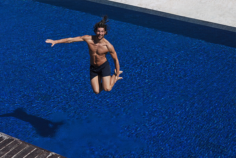Man wearing a navy blue swim shorts