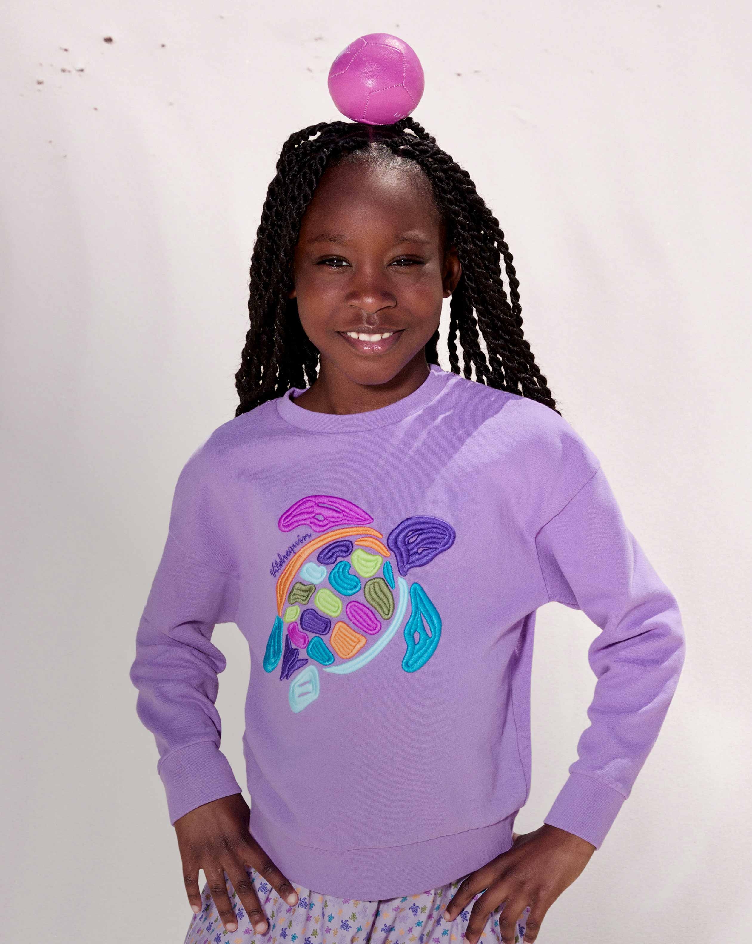 Girl wearing a red terry set with sunglasses